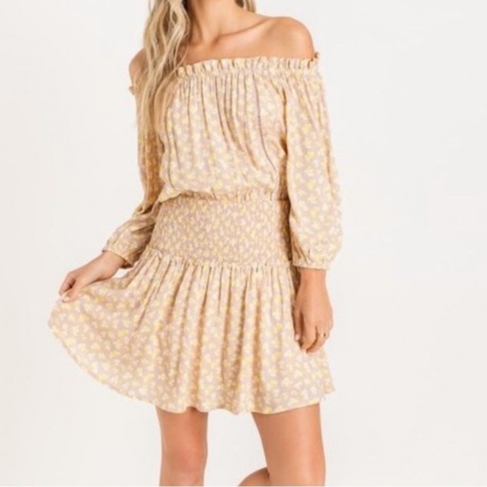 Lush mini dress. Off the shoulder and sinched waist makes for a flattering fit.